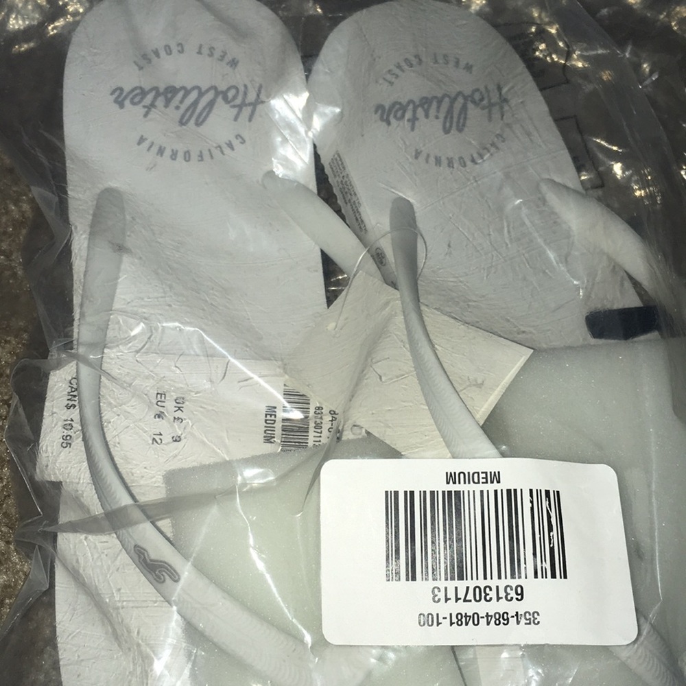 Brand new white flip flops